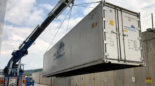 ArcticStore refrigerated container being installed for carbon fiber storage, enabling flexible –18°C cold storage expansion without disrupting manufacturing operations.